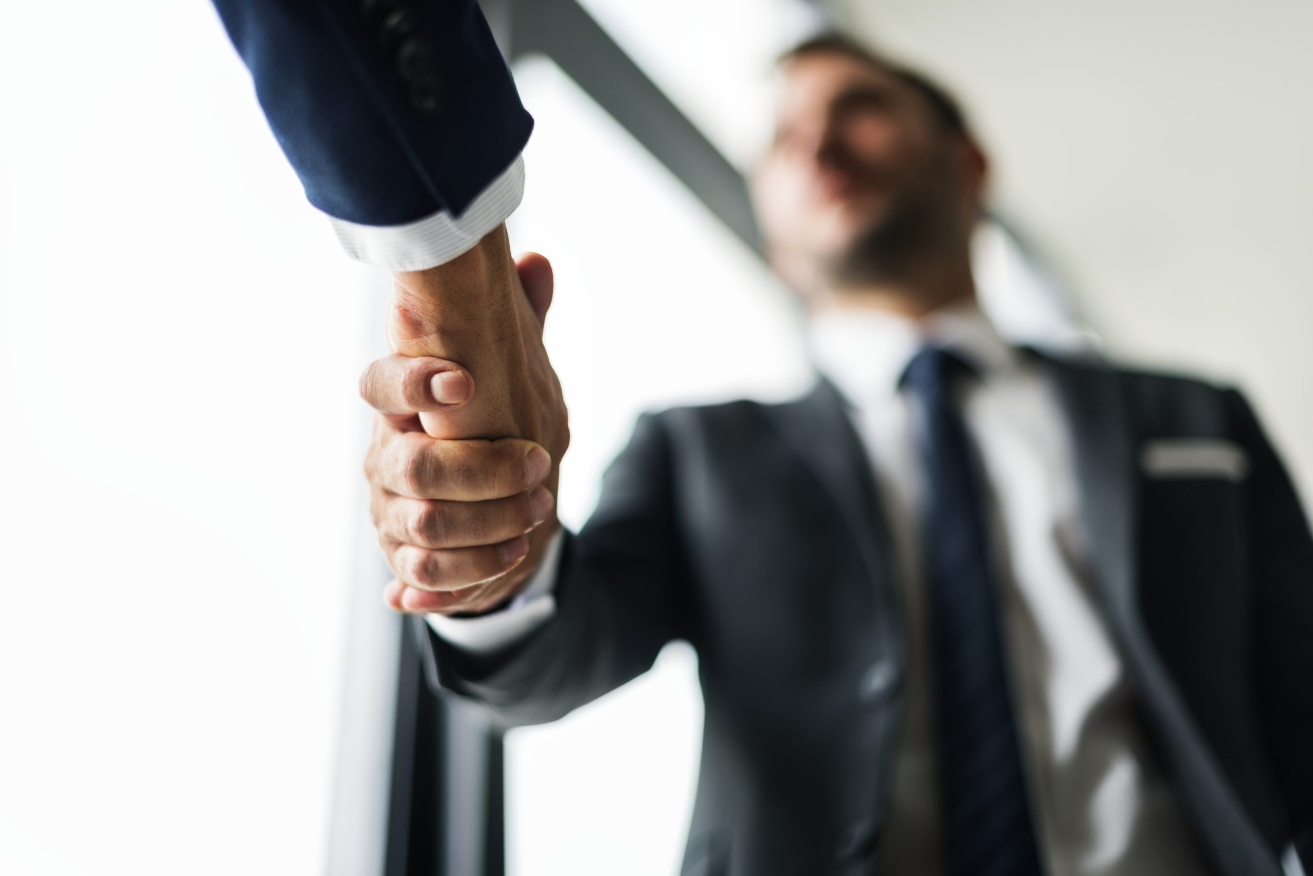 handshake business men concept scaled